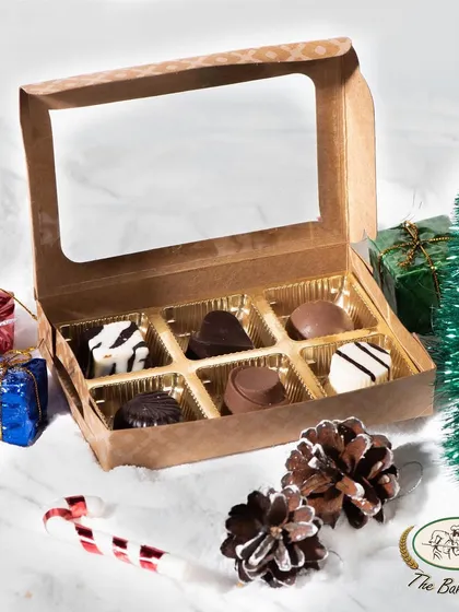 Another view of our six-piece assorted chocolate box, showcasing the elegant shapes and decorations of each handcrafted chocolate.