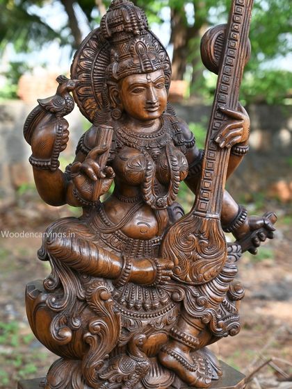Another close-up of the Abhinaya Saraswathi, focusing on the hand holding a small bird.