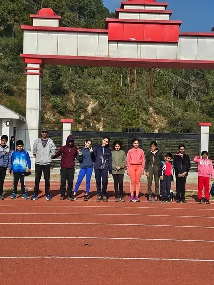The team lines up on the track at our high-altitude training facility. The crisp mountain air and professional track provide the perfect setting for focused, high-impact training sessions.