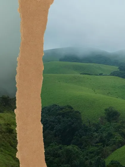 A torn paper effect revealing the misty green hills, symbolizing the discovery of nature's beauty on our treks.
