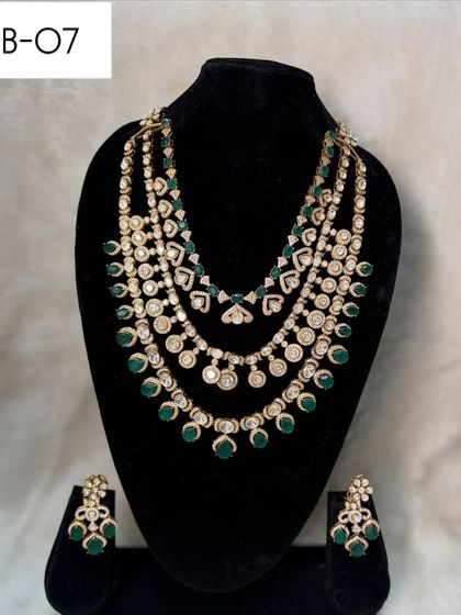 My layered bridal set B-07 features three distinct strands of polki and green beads. This design creates wonderful depth and is perfect for filling out a deep neckline.