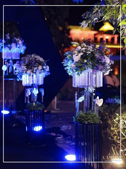 A collage showcasing the modern floral stands, where blooms were arranged in crystal-like structures and uplit with blue LEDs.