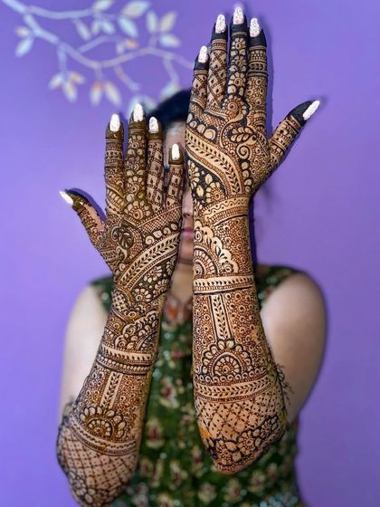 A stunning Arabic fusion design with bold, leafy patterns that flow beautifully up the arms.