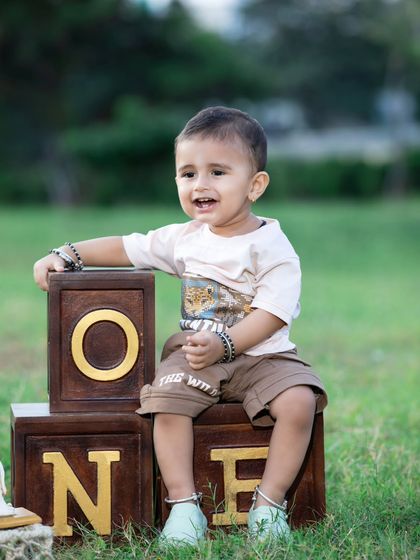 Another joyful shot from the outdoor first birthday celebration.