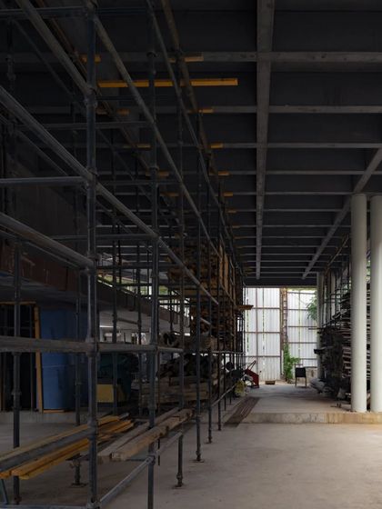 The dramatic, black exposed concrete of the lowest level of Office A in Hyderabad. This raw, cavernous space contrasts with the light-filled volumes planned for the upper floors.
