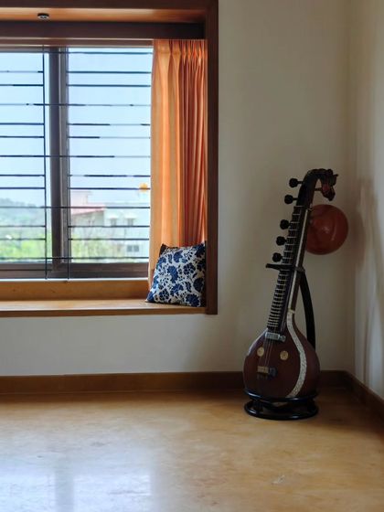 Another view of the veena and bay window, capturing the play of light and the simplicity of the Jaisalmer stone flooring.