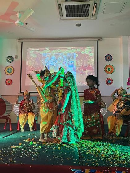 Students enact the wedding scene of Lord Rama and Sita, bringing the epic tale to life on stage.