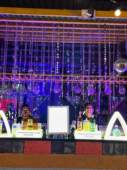 Our team behind a dazzling, fully-lit bar at a night cocktail affair in Vile Parle. This setup, with its hanging crystals and disco ball, created a glamorous, high-energy vibe.