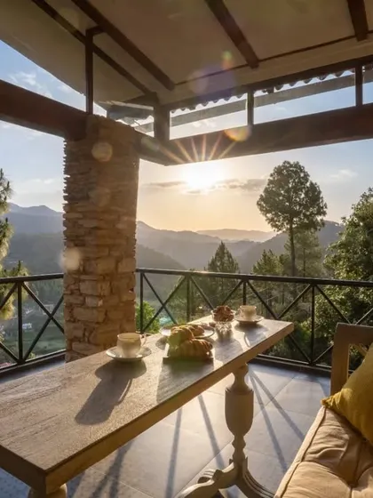 We design holiday homes that are a true escape, blending seamlessly with their majestic surroundings. This terrace at our Himalayan project offers a front-row seat to the sunset, with a design that uses local stone and natural materials to create a feeling of profound tranquility and connection to nature.