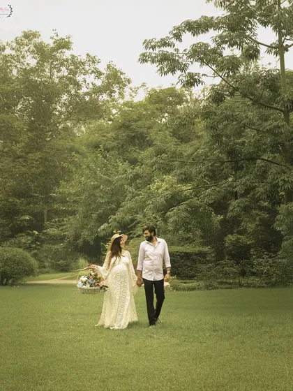 A shot of the couple walking hand-in-hand through the park, capturing the feeling of walking into their future together.