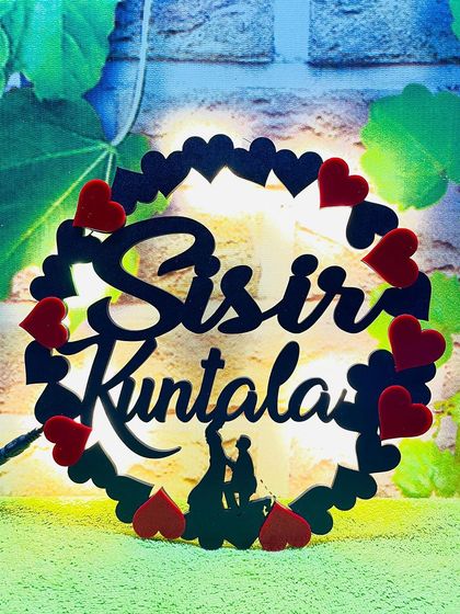 This custom LED prop is perfect for couples. I can create it with your names in a beautiful script, surrounded by hearts, and it lights up to create a romantic glow.