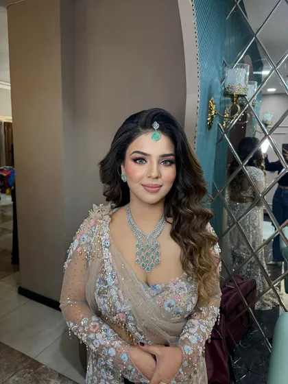 This client looks absolutely radiant. The soft glam makeup enhances her features without overpowering them, perfect for any special occasion.