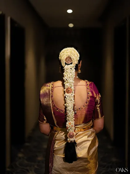 A stunning view of the traditional floral braid, a key element of the South Indian bridal look that I help coordinate.