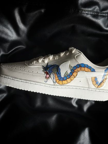 A side profile of the Gyarados custom sneaker, highlighting the detailed scales and fins.