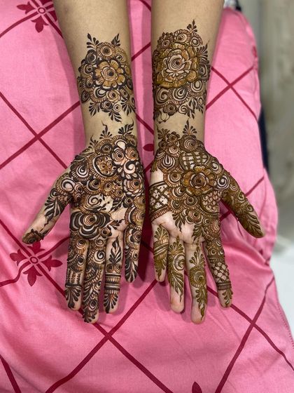 Both hands with a matching floral design.