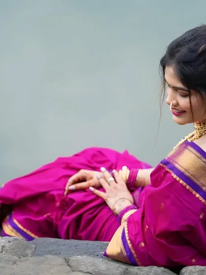 A serene shot of a model in a traditional Nauvari, showcasing the beautiful drape and hairstyle from the back.