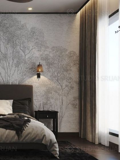 This angle shows the effect of the large window and sheer curtains, which cast a soft light on the nature-inspired wallpaper.