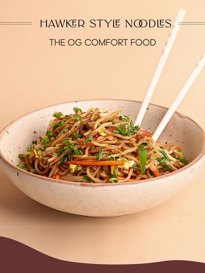 The OG comfort food: my Hawker Style Noodles. These noodles are stir-fried with fresh vegetables and a savory sauce, capturing the authentic taste of Asian street food with high-quality ingredients.