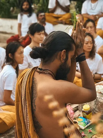 I lead a group of students in a sacred ritual. The focus and devotion in the room are palpable, creating a powerful environment for spiritual growth.