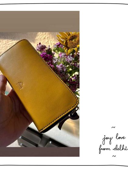 A sunny shot of the Joy wallet in Mango leather. This vibrant color was a limited edition and is now sold out.