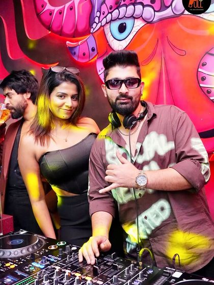 A quick photo with a fan during a Tuesday night set.