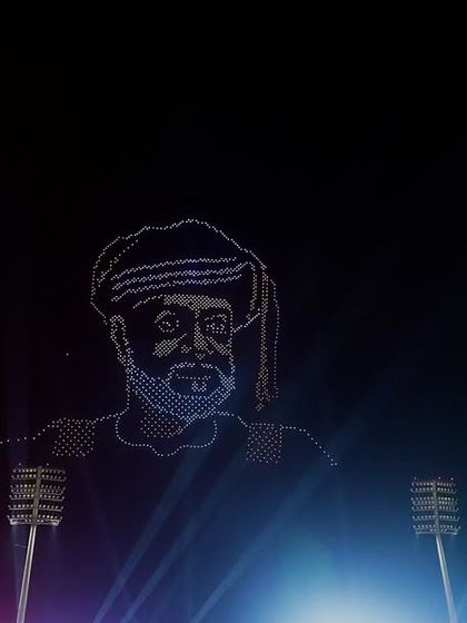 A portrait of a historic figure created with drones, illuminated by colorful stage lights, during our debut show in Oman. We can create detailed portraits to honor national heroes.