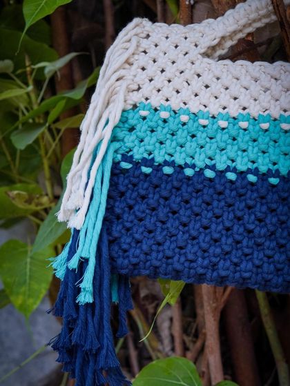 A close-up view of the 'Ocean Beauty' bag, showing the different textures and the cascading fringe detail. I use high-quality, durable cotton cords to ensure my bags are as strong as they are beautiful.