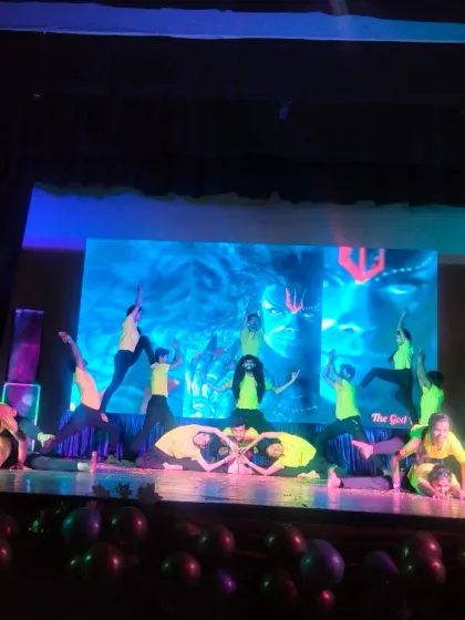 Another angle of our students' performance, showcasing their flexibility and coordination. We choreograph these sequences to tell a story through movement.