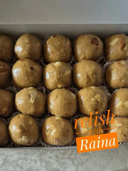 A box of Sattu Laddoos with jaggery, showing the rich, earthy color and texture. These are a wholesome and satisfying treat.