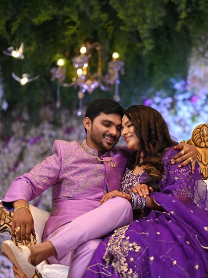 A romantic moment captured at the reception. The bride's soft, wavy hair and glowing makeup create a dreamy and elegant look.