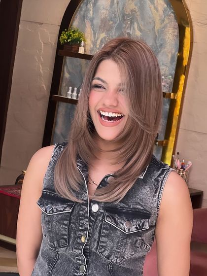 A stunning ash-toned global colour. This cool, modern shade is perfectly complemented by a sleek, layered haircut.