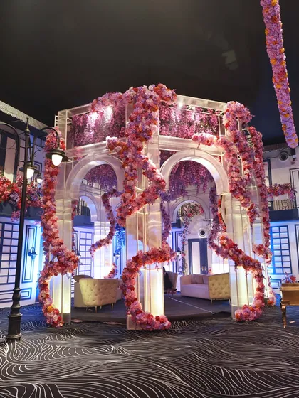 A stunning floral gazebo creating a romantic and whimsical photo opportunity, perfectly integrated into the event's overall design.