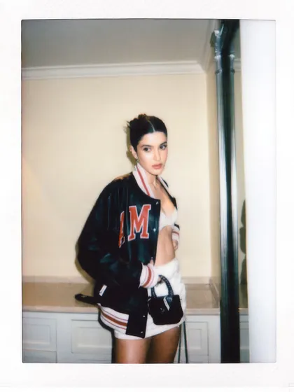 A candid instant film photo capturing a relaxed moment with Shanaya Kapoor during our styling session.