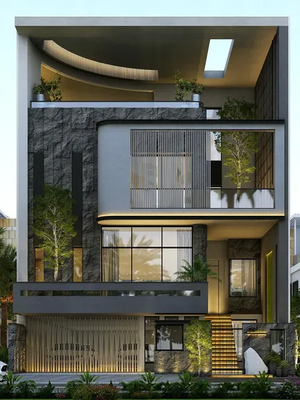 This design for a home in Shubham Enclave features a dramatic, dark stone-clad volume and a floating staircase. The top floor includes a curved roof and a skylight, creating a unique architectural profile.