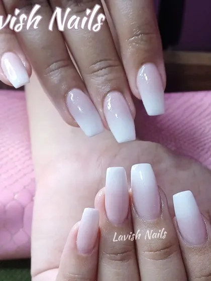 A clean and classic Baby Boomer ombre on medium-length coffin nails.