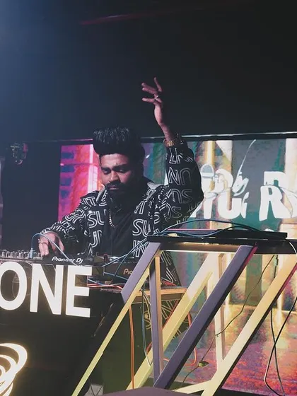 A close-up of me at the Cyclone-branded DJ console.