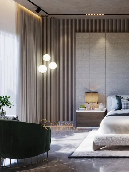 This bedroom design uses a sophisticated palette of grey and dark wood, with fluted panels and soft lighting creating a moody yet comfortable retreat.