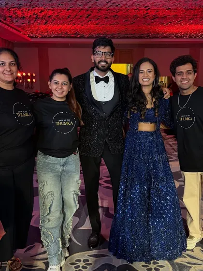 Posing with the bride and groom after a successful Sangeet night. We even have our own team shirts to bring that professional and united vibe.