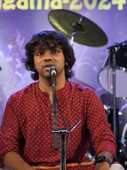 A close-up of our guru Durgaprasad Sir during the flute performance, showcasing his passion and expertise.