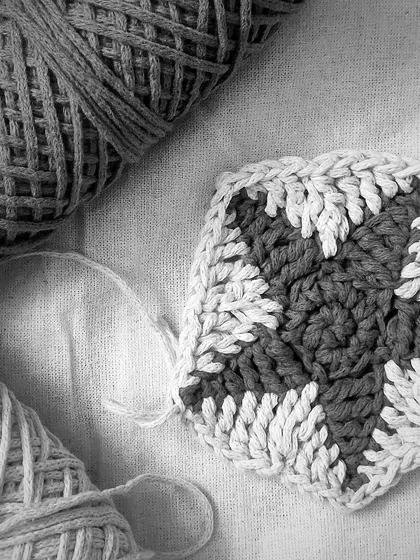 A simple two-toned granny square. Crocheting has taught me the beauty of learning and unlearning. Every stitch is a lesson in patience and growth, and there's beauty in these simple moments.