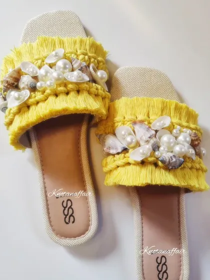 These custom macrame slippers were so much fun to make for a bride's haldi ceremony. I used a bright yellow cotton cord and adorned them with beautiful seashells and pearls for that perfect beachy, festive look. If you have a special occasion, I'd love to create something unique for you.