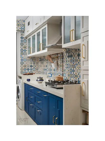 The Moroccan-Scandinavian kitchen with its royal blue under-counter cabinets and patterned tile backsplash.