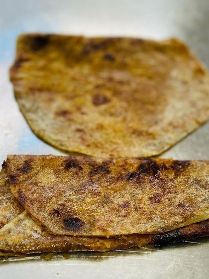 Freshly made Bele Holige (or Puran Poli), a traditional sweet flatbread. This is a must-have for festivals and traditional functions, served hot with a dollop of ghee.