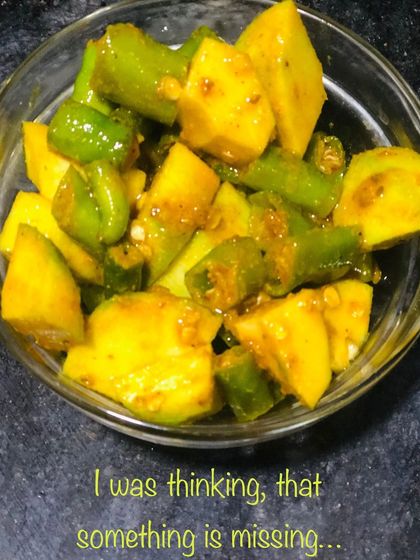 Homemade pickles are a fantastic probiotic that can improve gut health. This is a raw mango and green chili pickle. When made at home with low-sodium salt and healthy spices, a small amount with meals can aid digestion and even help manage muscle cramps.
