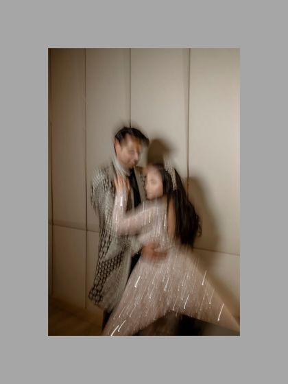 An artistic motion-blur shot capturing the couple in a dance. This abstract image conveys the energy and romance of their celebration in a unique, impressionistic style.