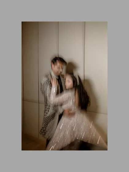 An artistic motion-blur photograph of Abhinav and Paromita dancing. This creative shot captures the movement and energy of their celebration in a dreamy, abstract way.