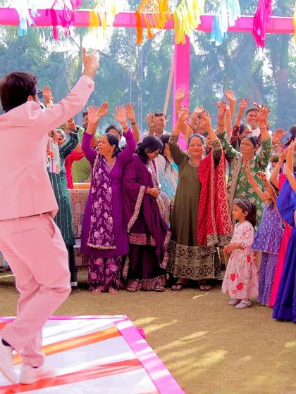 From the back, you can see how I lead the crowd in a dance routine. It's all about participation and collective fun.
