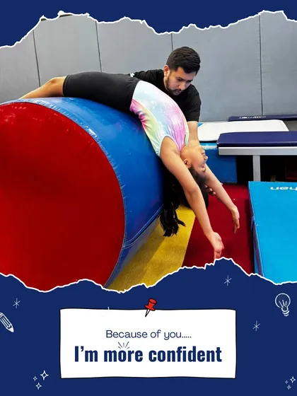 "Because of you, I'm more confident." A coach carefully assists a young gymnast with a backbend over a barrel, building both her skill and her self belief.