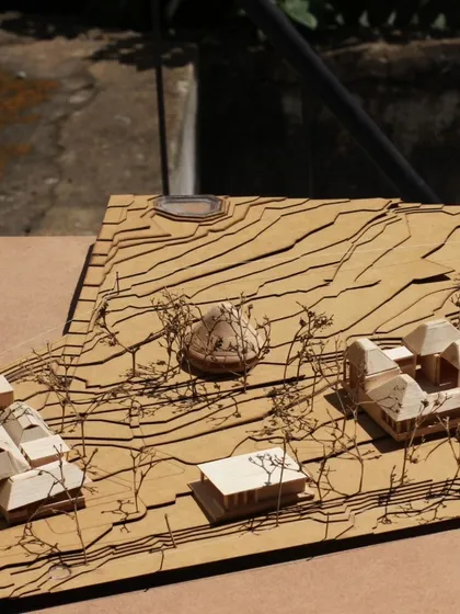 A site model for the 'Serenity' project, showing the contoured landscape and the placement of the various buildings.