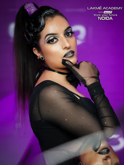A creative and edgy glam look. The sheer gloves and black lipstick add a touch of mystery and high fashion to this student's portfolio piece.